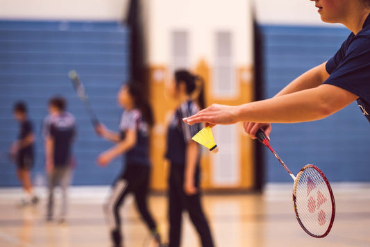 Man serving badminton